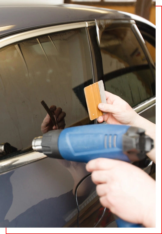 A person holding a blow gun and a card